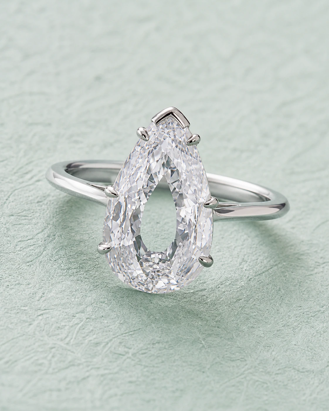 Platinum solitaire ring set with a 12 Ct. D IF Old Mine pear diamond