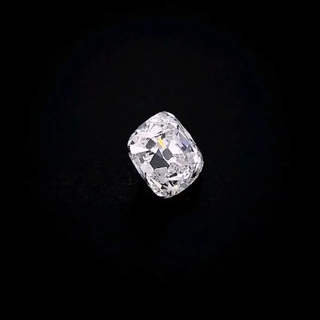 A cushion diamond against black