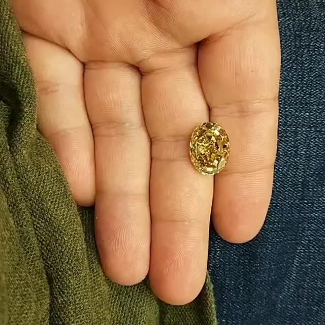 A yellow diamond in hand